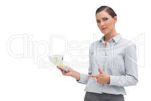 Businesswoman showing money in her hand