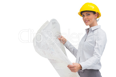 Happy architect holding plan