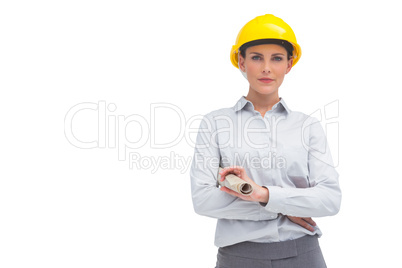 Architect woman with yellow helmet and rolled up plan