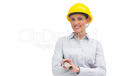 Smiling architect holding rolled up plan