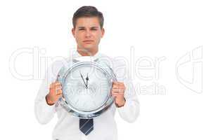 Businessman holding a clock