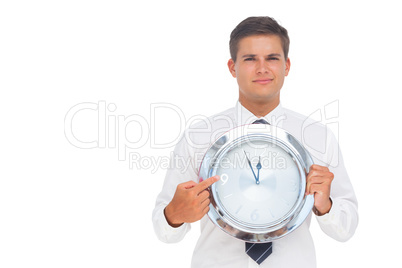 Businessman holding a clock