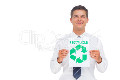 Happy businessman showing a paper with environmental awareness s