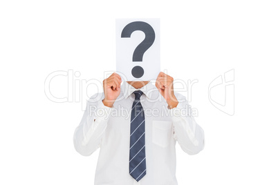 Businessman holding a paper with a question mark over face