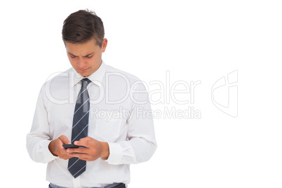 Serious businessman texting Serious businessman texting