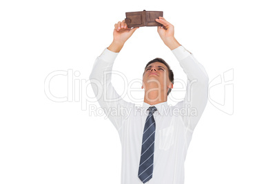 Businessman looking at his empty wallet