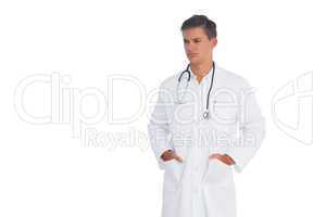 Doctor frowning with hands in pocket