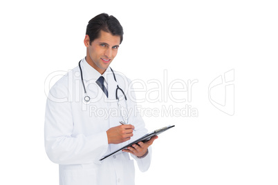 Young doctor holding a clipboard and pen