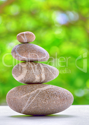 stone pyramid over natural background
