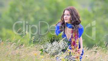 girl with bouquet  in field