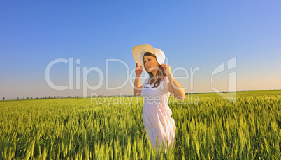 beautiful girl with hat in the field