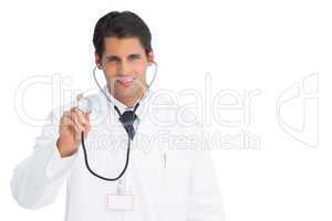 Happy doctor holding up stethoscope