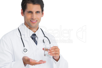 Happy doctor holding tablets and water