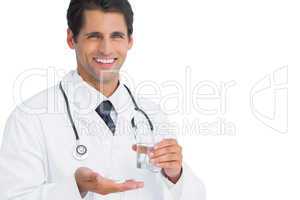 Smiling doctor holding tablets and water