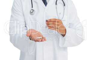 Doctor holding drugs and glass of water