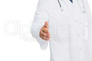 Doctor reaching out for handshake