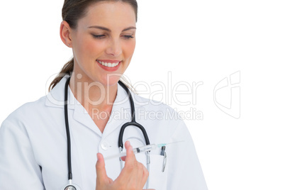 Happy nurse holding a syringe