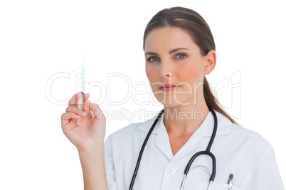 Stern nurse holding a syringe Stern nurse holding a syringe