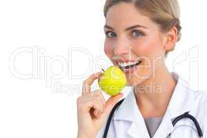 Nurse showing green apple