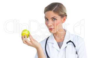 Nurse holding apple