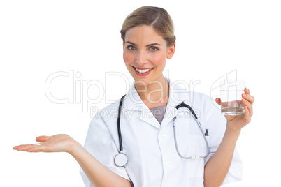 Nurse offering drugs and water glass