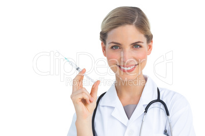 Cheerful nurse holding syringe