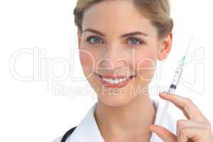 Smiling nurse holding syringe