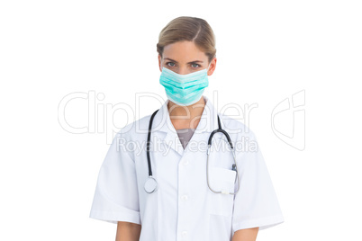 Serious nurse wearing surgical mask