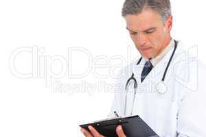 Man doctor writing on clipboard