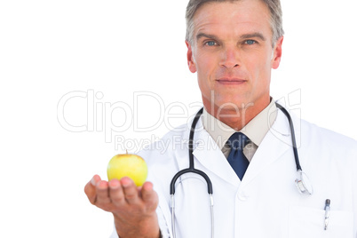 Doctor showing apple Doctor showing apple