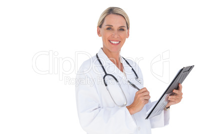 Happy doctor holding pen and clipboard