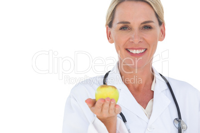 Happy doctor holding apple Happy doctor holding apple