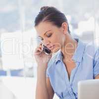 Businesswoman calling with her mobile phone