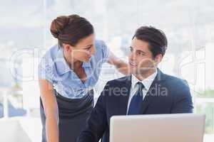 Business people look at each other and smiling