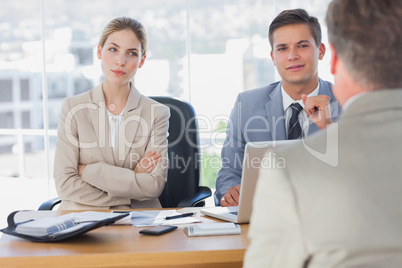Happy business people interviewing business man