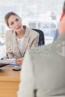 Smiling businesswoman looking at interviewee