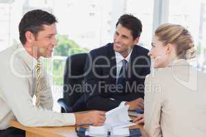 Business people smiling during a meeting