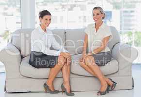Business women sitting on the couch