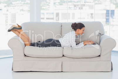 Business woman lying on couch