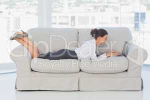 Business woman lying on couch