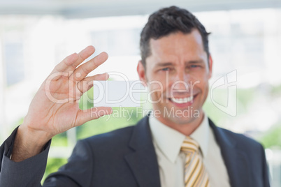 Businessman showing blank business card