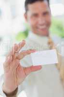 Businessman presenting white business card