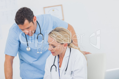 Blonde doctor working with her colleague