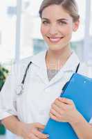 Radiant nurse holding a folder