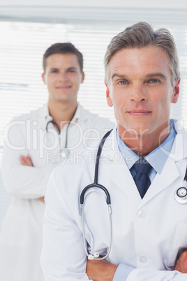 Serious doctor with arms crossed standing Serious doctor with arms crossed standing