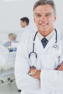 Attractive doctor with arms crossed