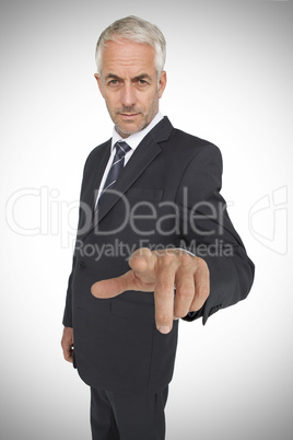 Businessman pointing the camera