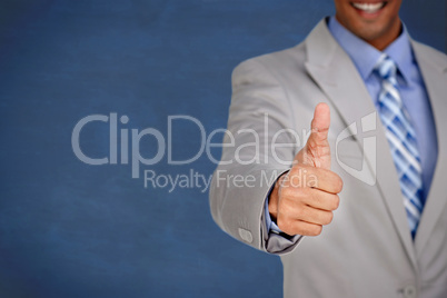 Businessman giving thumbs up