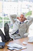 Businessman relaxing at his desk