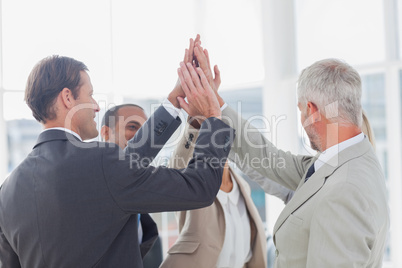 Business team high fiving